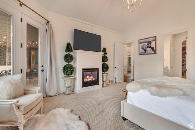 12483 N Timberline Dr, Highland, UT 84003 - carpeted bedroom with ensuite bath, vaulted ceiling, visible vents, and a glass covered fireplace