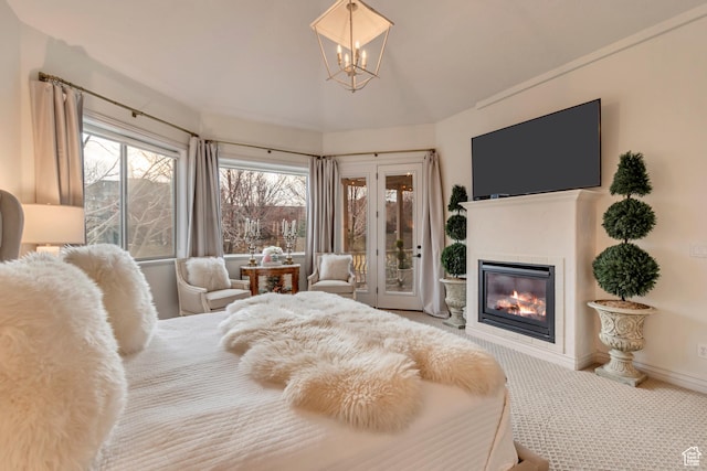 12483 N Timberline Dr, Highland, UT 84003 - carpeted bedroom with baseboards, a notable chandelier, a glass covered fireplace, and access to outside