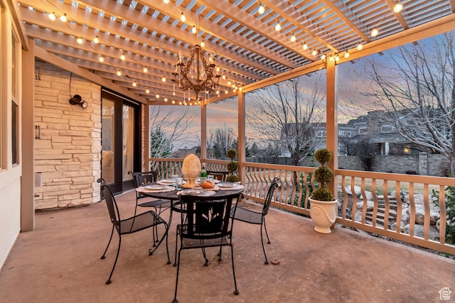12483 N Timberline Dr, Highland, UT 84003 - patio terrace at dusk featuring a pergola and outdoor dining space