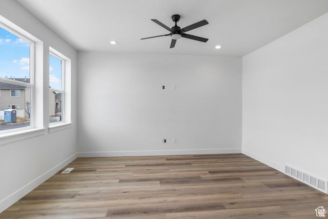241 W 1160 N Unit 17, Tooele, UT 84074 - unfurnished room featuring visible vents, baseboards, ceiling fan, wood finished floors, and recessed lighting