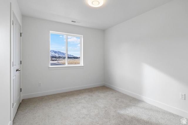 241 W 1160 N Unit 17, Tooele, UT 84074 - unfurnished room featuring baseboards, visible vents, and carpet