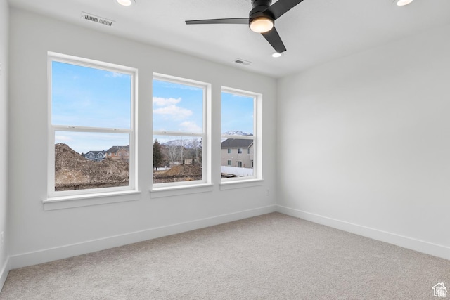 241 W 1160 N Unit 17, Tooele, UT 84074 - carpeted empty room with baseboards, ceiling fan, and visible vents