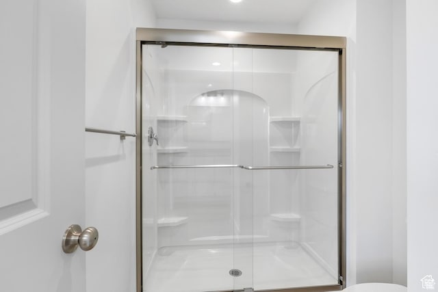 241 W 1160 N Unit 17, Tooele, UT 84074 - bathroom with a stall shower and toilet