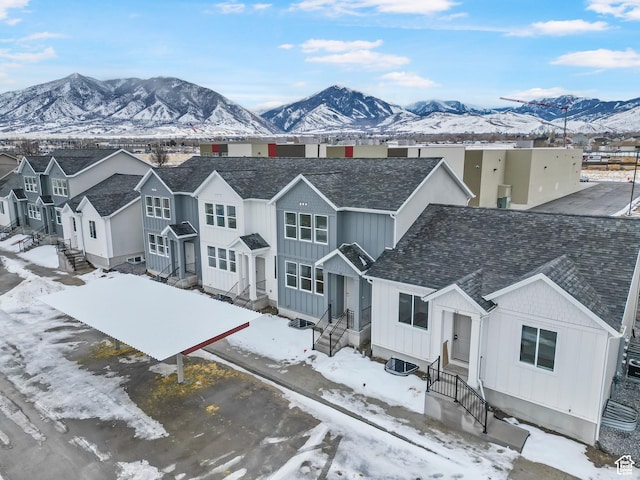 241 W 1160 N Unit 17, Tooele, UT 84074 - view of front facade featuring board and batten siding, roof with shingles, a mountain view, and a residential view