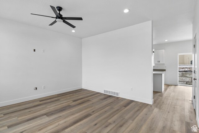 241 W 1160 N Unit 17, Tooele, UT 84074 - unfurnished living room with light wood-type flooring, visible vents, recessed lighting, and a ceiling fan