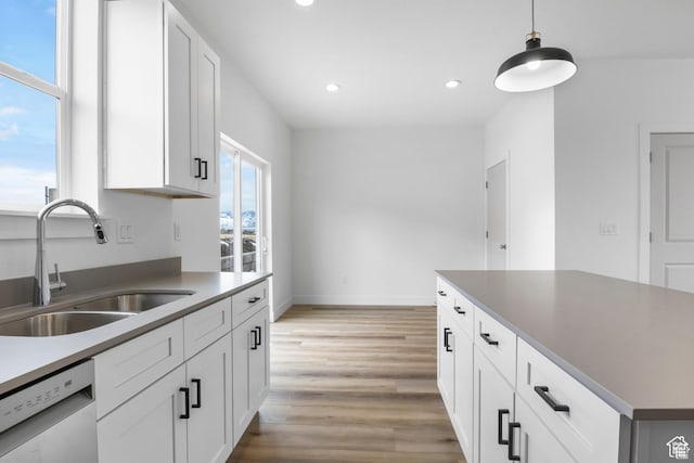 241 W 1160 N Unit 17, Tooele, UT 84074 - kitchen featuring a sink, stainless steel dishwasher, hanging light fixtures, light wood-style floors, and recessed lighting