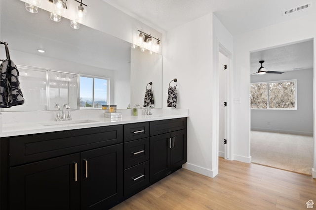 695 N Plainsman Dr Unit 110, Spanish Fork, UT 84660 - bathroom featuring a ceiling fan, visible vents, a sink, double vanity, and baseboards