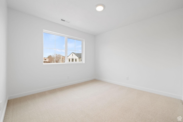 695 N Plainsman Dr Unit 110, Spanish Fork, UT 84660 - unfurnished room featuring light carpet, visible vents, and baseboards