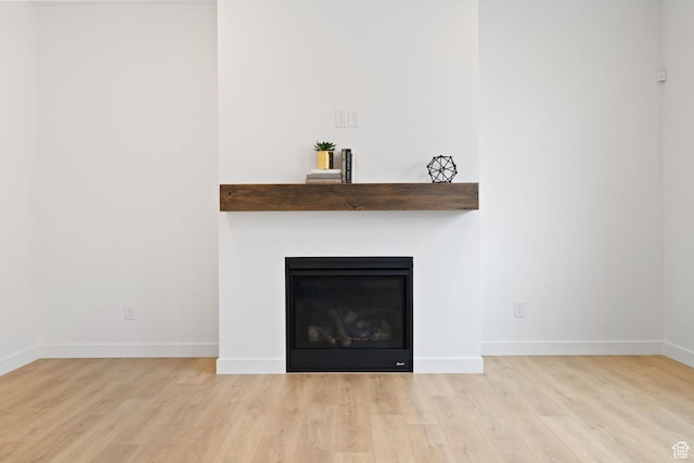 695 N Plainsman Dr Unit 110, Spanish Fork, UT 84660 - details featuring wood finished floors, a fireplace, and baseboards