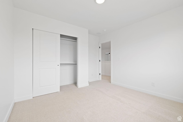 695 N Plainsman Dr Unit 110, Spanish Fork, UT 84660 - unfurnished bedroom featuring light carpet, baseboards, and a closet