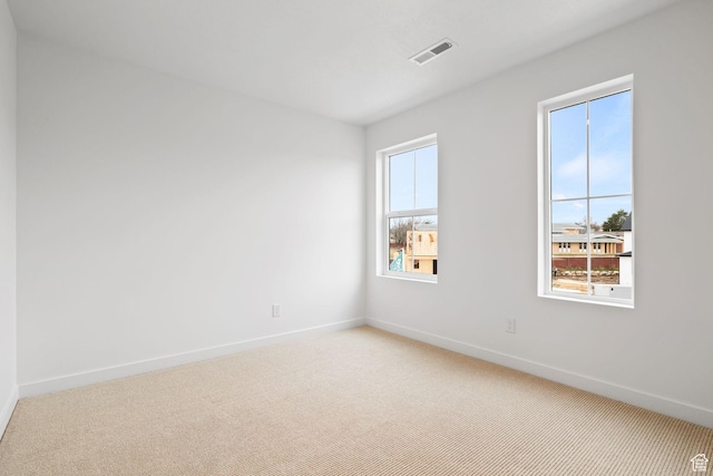 695 N Plainsman Dr Unit 110, Spanish Fork, UT 84660 - spare room with visible vents, baseboards, and light carpet