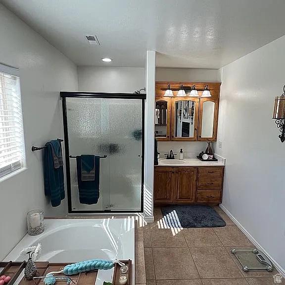 1345 W 1625 S, Price, UT 84501 - full bathroom featuring visible vents, vanity, a stall shower, a garden tub, and tile patterned flooring
