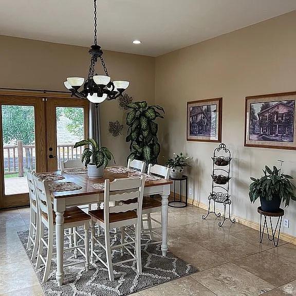 1345 W 1625 S, Price, UT 84501 - dining space with baseboards and a notable chandelier