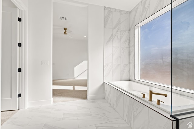 1522 N Zion Cir, Apple Valley, UT 84737 - bathroom featuring a relaxing tiled tub, visible vents, baseboards, marble finish floor, and a ceiling fan