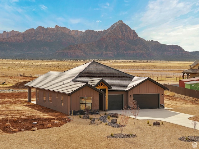 1522 N Zion Cir, Apple Valley, UT 84737 - view of front of property featuring concrete driveway, fence, a tiled roof, a garage, and a mountain view