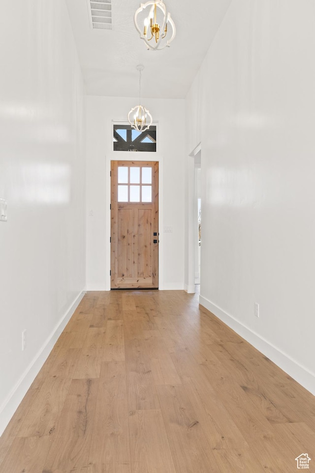 1522 N Zion Cir, Apple Valley, UT 84737 - entryway featuring baseboards, visible vents, light wood-style floors, and a notable chandelier