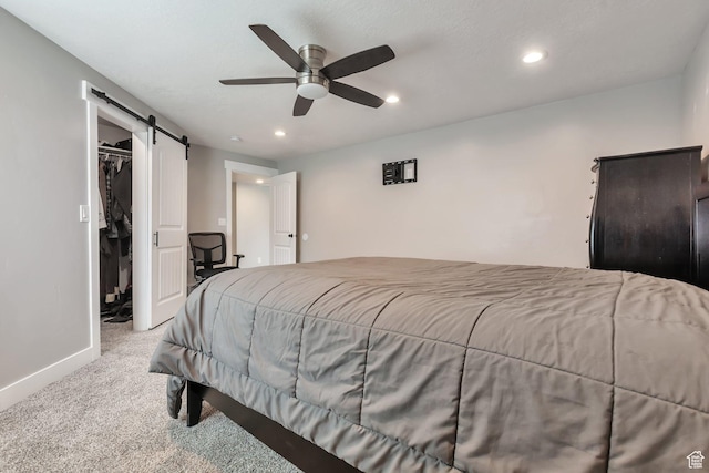 13907 S Birch Leaf W, Herriman, UT 84096 - carpeted bedroom with recessed lighting, a spacious closet, baseboards, a barn door, and ceiling fan