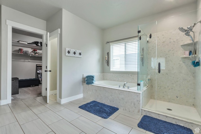 13907 S Birch Leaf W, Herriman, UT 84096 - full bathroom with a bath, baseboards, a spacious closet, and a shower stall