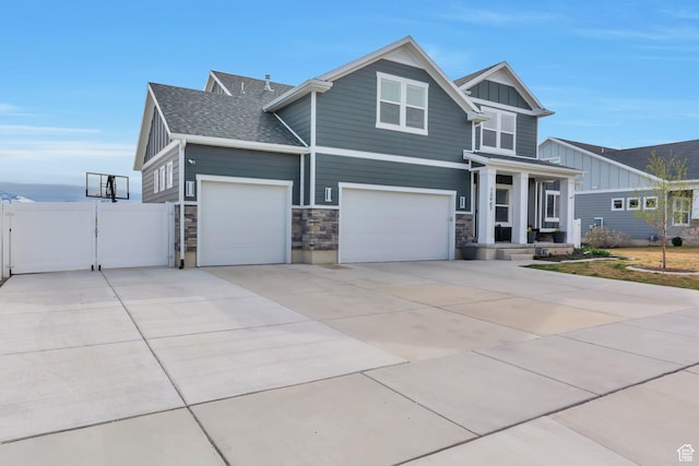 13907 S Birch Leaf W, Herriman, UT 84096 - craftsman inspired home featuring roof with shingles, stone siding, board and batten siding, driveway, and a gate