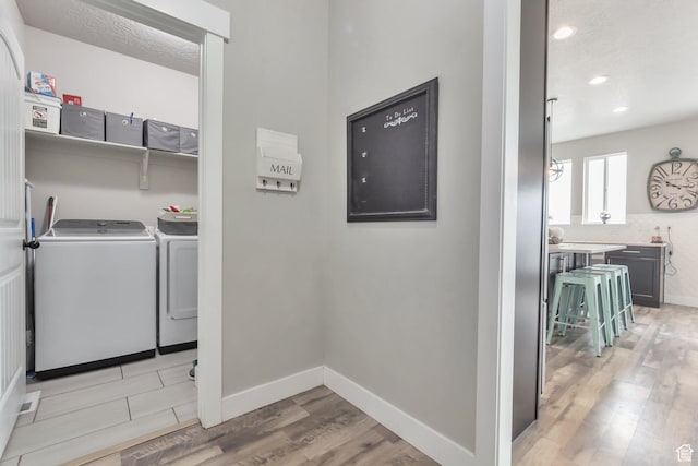 13907 S Birch Leaf W, Herriman, UT 84096 - laundry room with recessed lighting, baseboards, light wood finished floors, washer and dryer, and laundry area