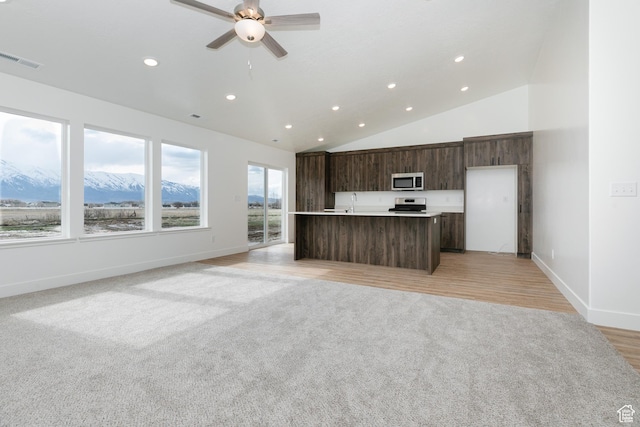 3291 S 1000 W, Nibley, UT 84321 - kitchen with visible vents, modern cabinets, ceiling fan, appliances with stainless steel finishes, and dark brown cabinetry