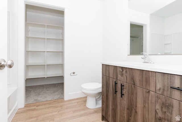 3291 S 1000 W, Nibley, UT 84321 - bathroom featuring wood finished floors, toilet, and vanity