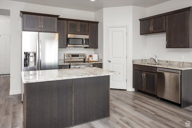 250 W 1200 S Unit 118, Tremonton, UT 84337 - kitchen with dark brown cabinetry, wood finished floors, and appliances with stainless steel finishes