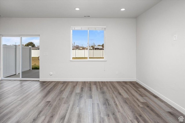 250 W 1200 S Unit 118, Tremonton, UT 84337 - empty room with a wealth of natural light, wood finished floors, and baseboards