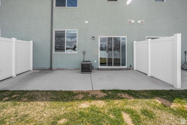 250 W 1200 S Unit 118, Tremonton, UT 84337 - rear view of property featuring stucco siding, fence, central AC unit, a patio area, and a lawn