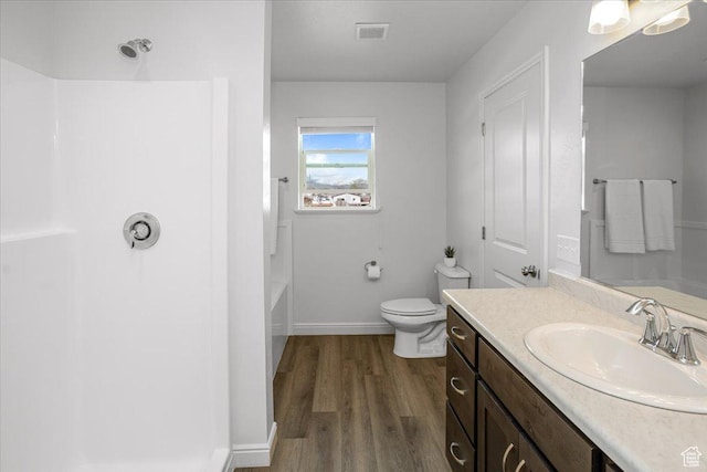 250 W 1200 S Unit 118, Tremonton, UT 84337 - bathroom with a shower, baseboards, wood finished floors, toilet, and vanity