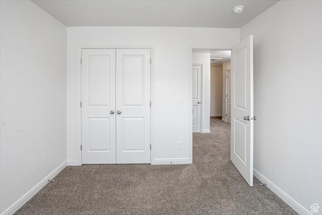 250 W 1200 S Unit 118, Tremonton, UT 84337 - unfurnished bedroom featuring carpet floors, baseboards, and a closet