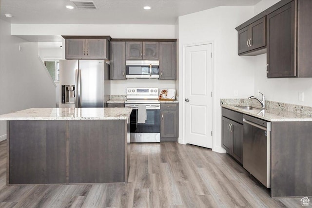 250 W 1200 S Unit 118, Tremonton, UT 84337 - kitchen with a sink, dark brown cabinetry, appliances with stainless steel finishes, and visible vents