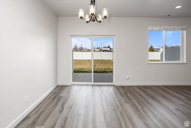 250 W 1200 S Unit 118, Tremonton, UT 84337 - unfurnished dining area with plenty of natural light, baseboards, and a chandelier