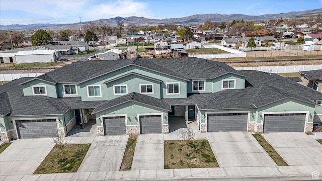 250 W 1200 S Unit 118, Tremonton, UT 84337 - view of front of house with stone siding, driveway, a mountain view, and a residential view