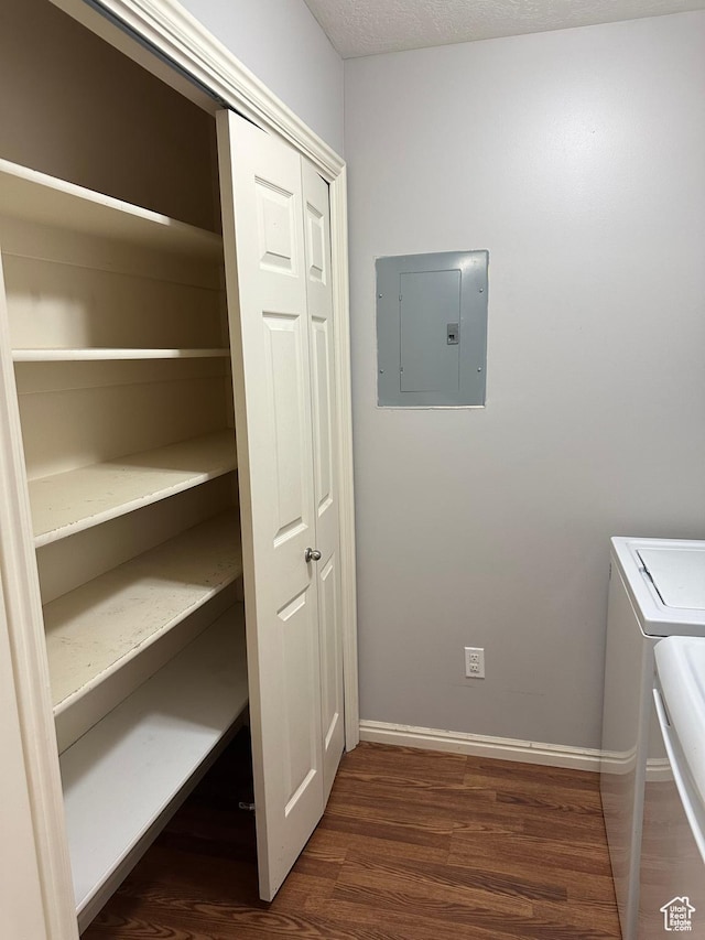 706 S 1690 W, Logan, UT 84321 - clothes washing area featuring dark wood-style flooring, baseboards, separate washer and dryer, and electric panel