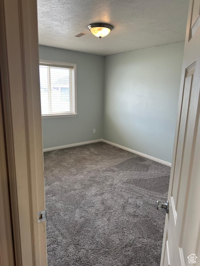 706 S 1690 W, Logan, UT 84321 - unfurnished room featuring baseboards, carpet floors, and a textured ceiling