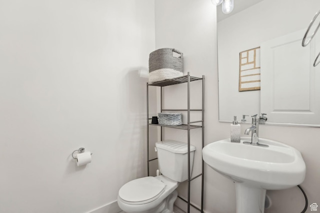 795 N Brook Ave, Tooele, UT 84074 - half bathroom with baseboards, toilet, and a sink