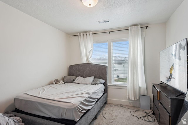 795 N Brook Ave, Tooele, UT 84074 - bedroom with baseboards, a textured ceiling, visible vents, and light colored carpet