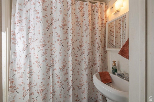 263 W Center St, Logan, UT 84321 - bathroom featuring a shower with curtain and a sink