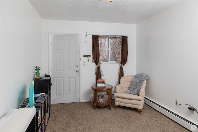 263 W Center St, Logan, UT 84321 - living area with baseboard heating, carpet floors, and a textured ceiling