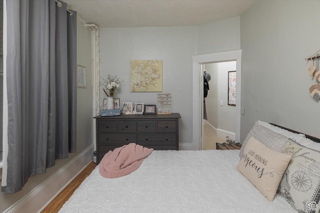 263 W Center St, Logan, UT 84321 - bedroom with baseboards and wood finished floors
