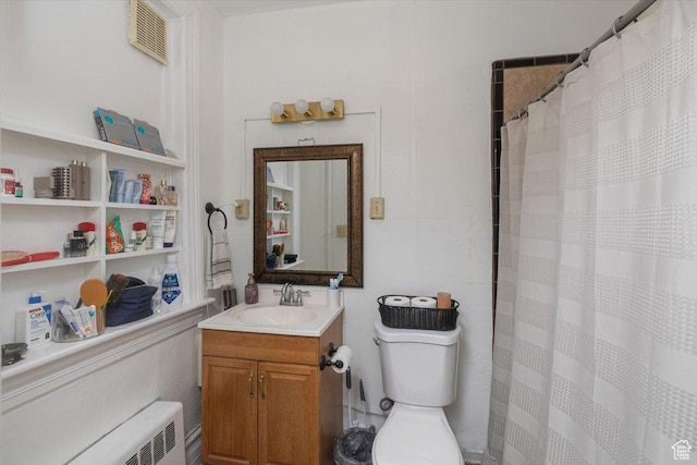 263 W Center St, Logan, UT 84321 - bathroom with visible vents, a shower with shower curtain, toilet, vanity, and radiator