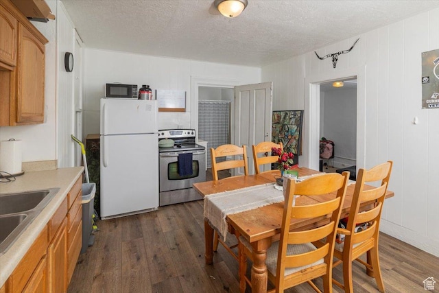263 W Center St, Logan, UT 84321 - dining room featuring a textured ceiling and dark wood finished floors