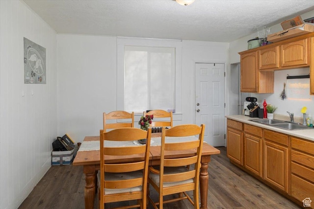 263 W Center St, Logan, UT 84321 - dining room featuring dark wood-style flooring and a textured ceiling