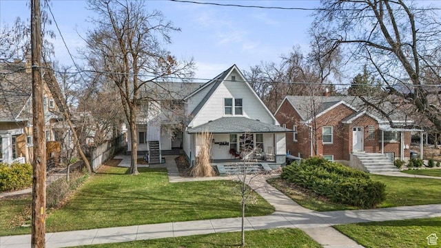 bungalow-style house with a front lawn