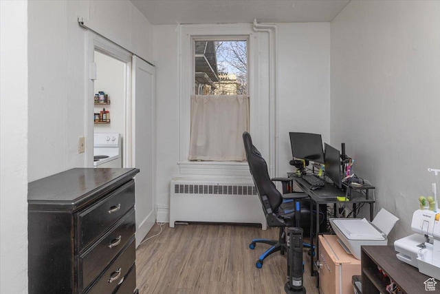 263 W Center St, Logan, UT 84321 - office area with radiator heating unit and light wood-style flooring