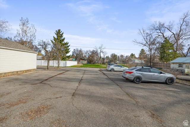 263 W Center St, Logan, UT 84321 - uncovered parking lot with fence