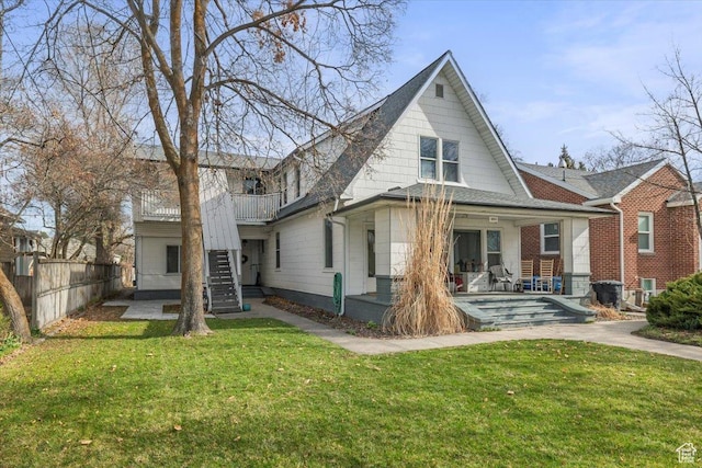 263 W Center St, Logan, UT 84321 - rear view of property featuring a yard, fence, and stairs