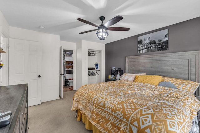 bedroom with light colored carpet and a ceiling fan