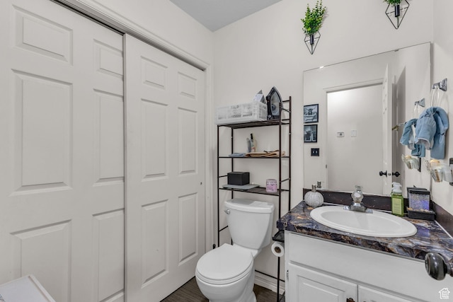 half bath with toilet and vanity